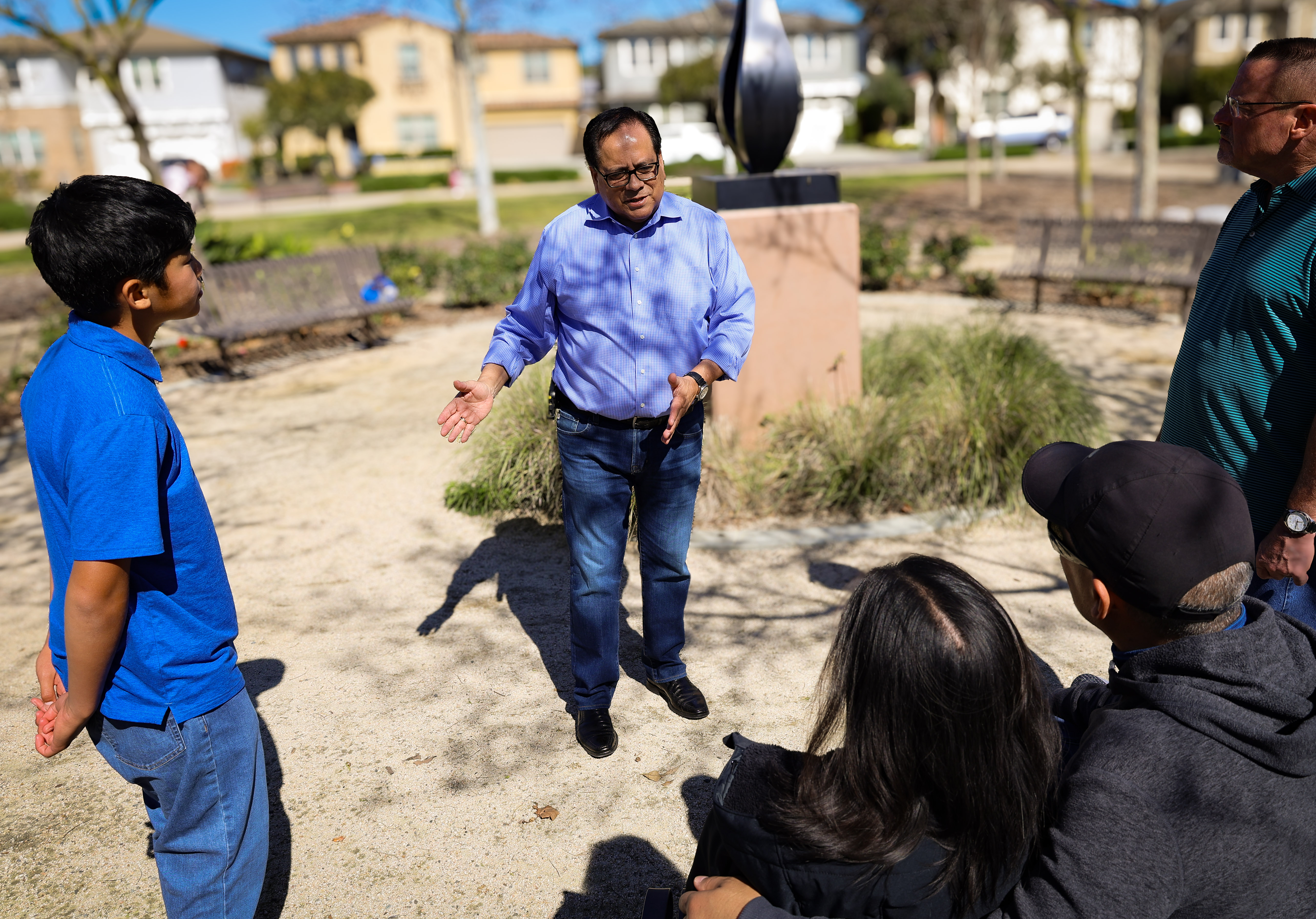 Paulo Morales talking with young people in the community