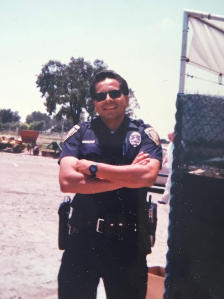 Paulo Morales at his desk, law enforcement professional